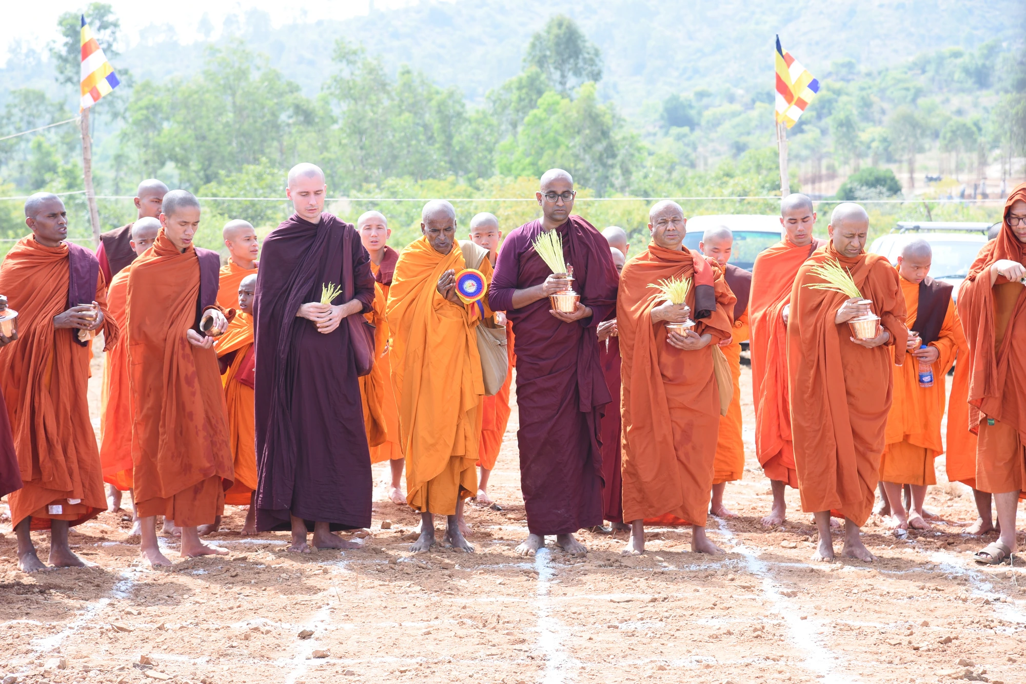 Monks standing in procession with offerings