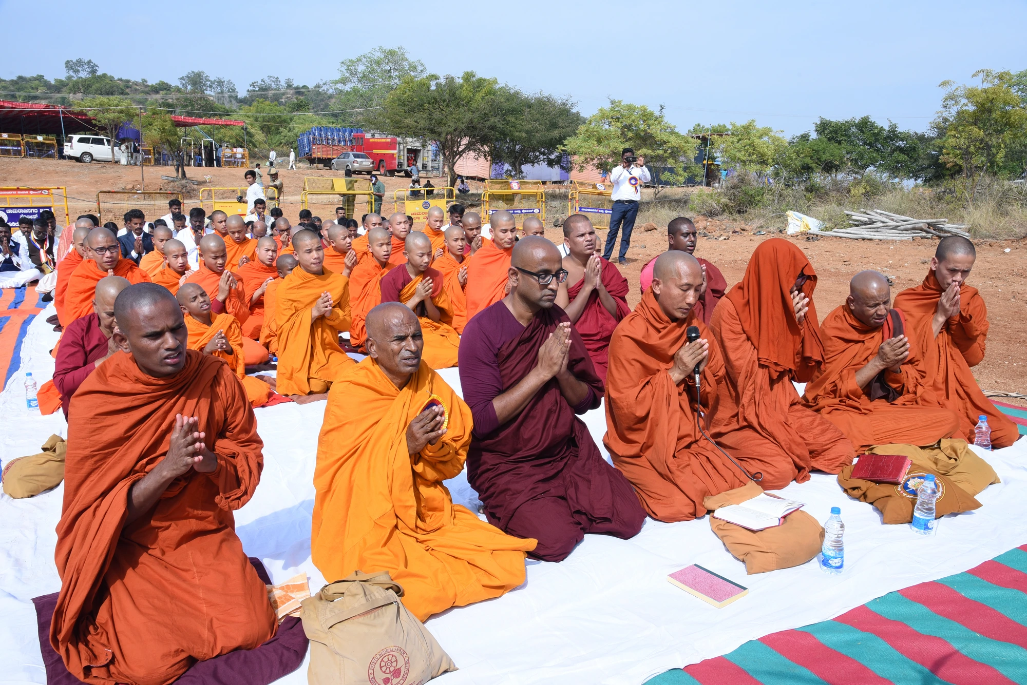 A large gathering of IBMCT monastics and community members in seated prayer