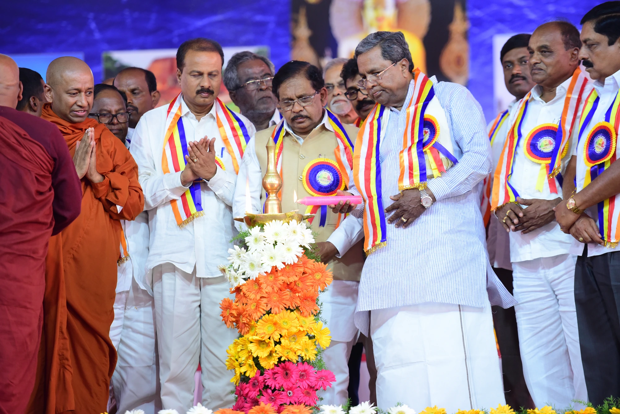 Dignitaries lighting the ceremonial lamp at an IBMCT event