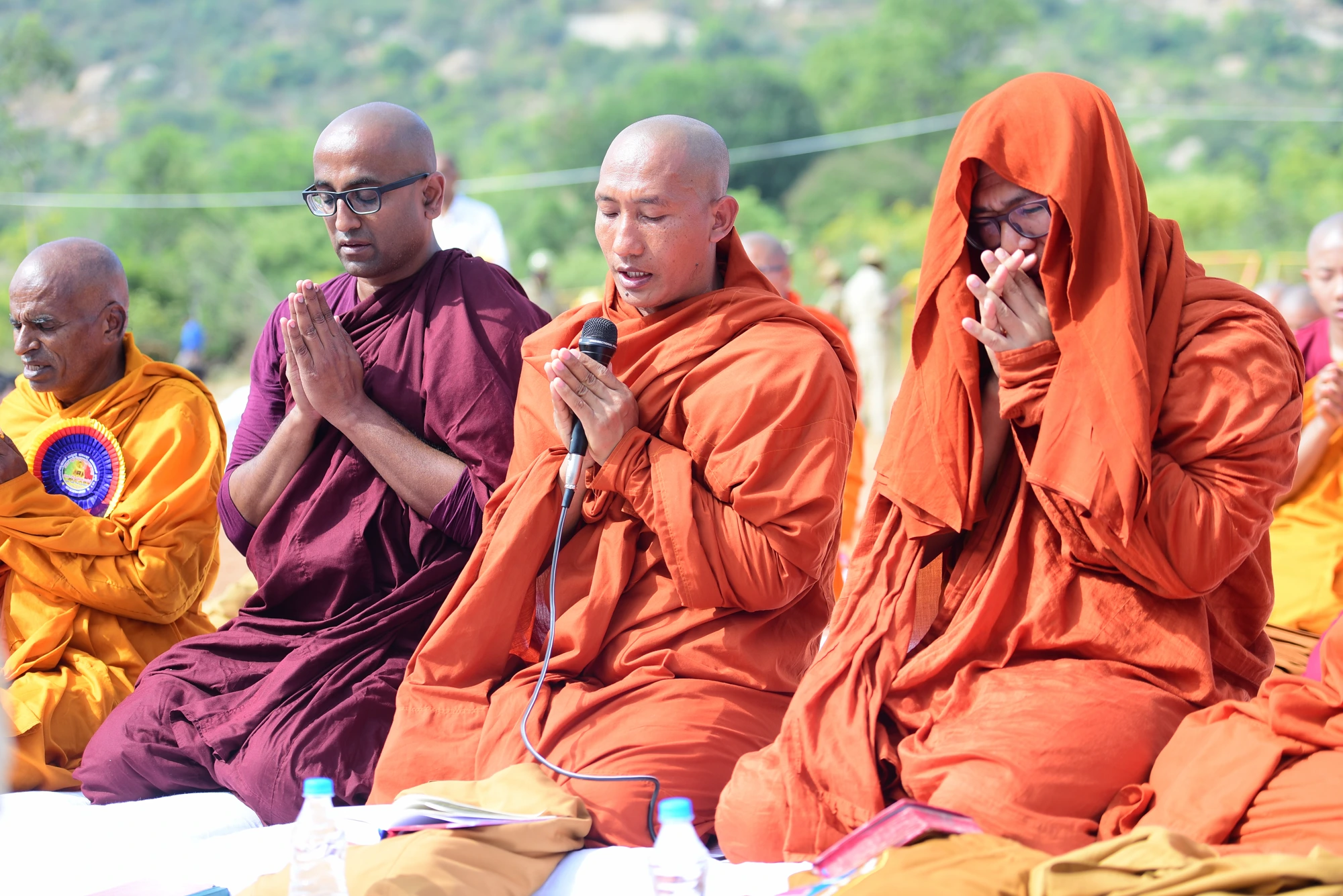 IBMCT monastics seated in chanting and prayer